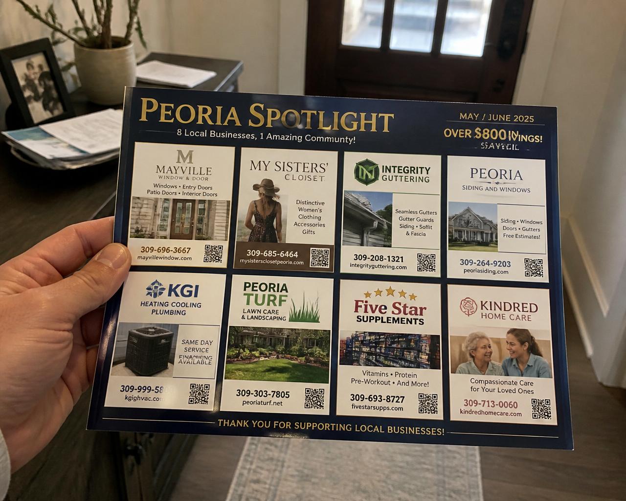 Hands holding the premium 9x12 Peoria Spotlight postcard showing 8 local advertisers